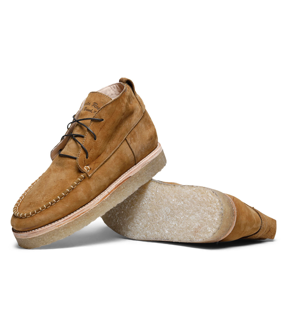 A pair of Santa Rosa Brand Tahoma Moccasin boots made of peanut kudu leather isolated on a white background.