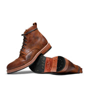A pair of brown leather Larry Boot Santa Rosa Brand boots with vegetable tanned lining on a white background.