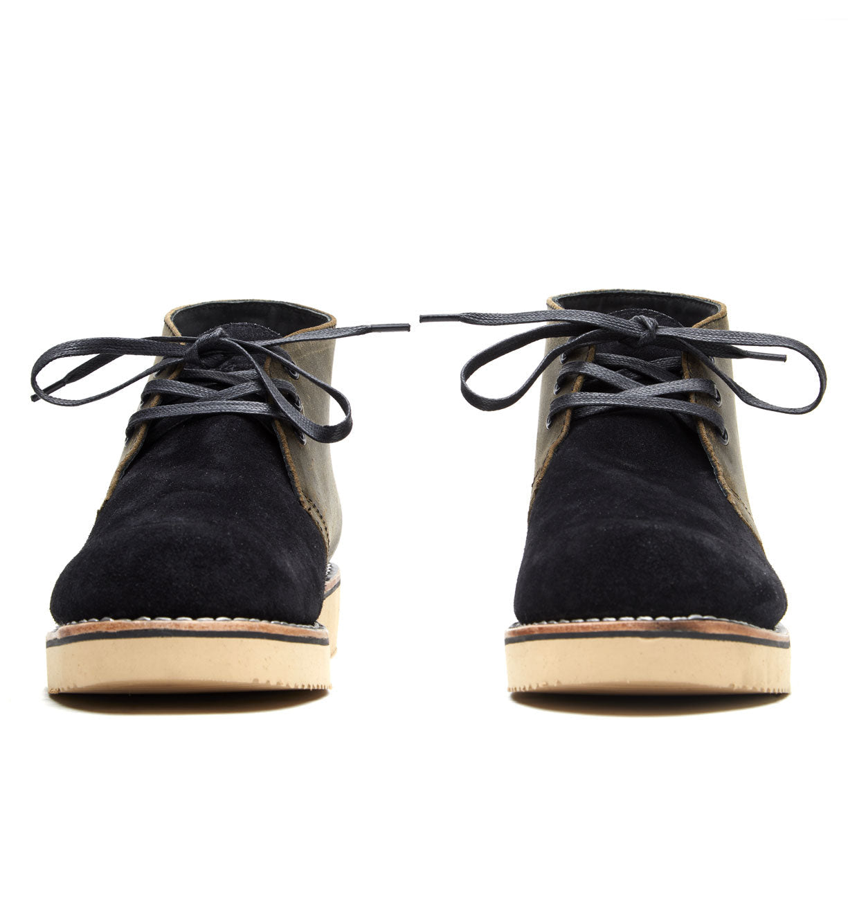 A pair of black sued boots from the Santa Rosa Brand collection with tan laces, called Union Boot.