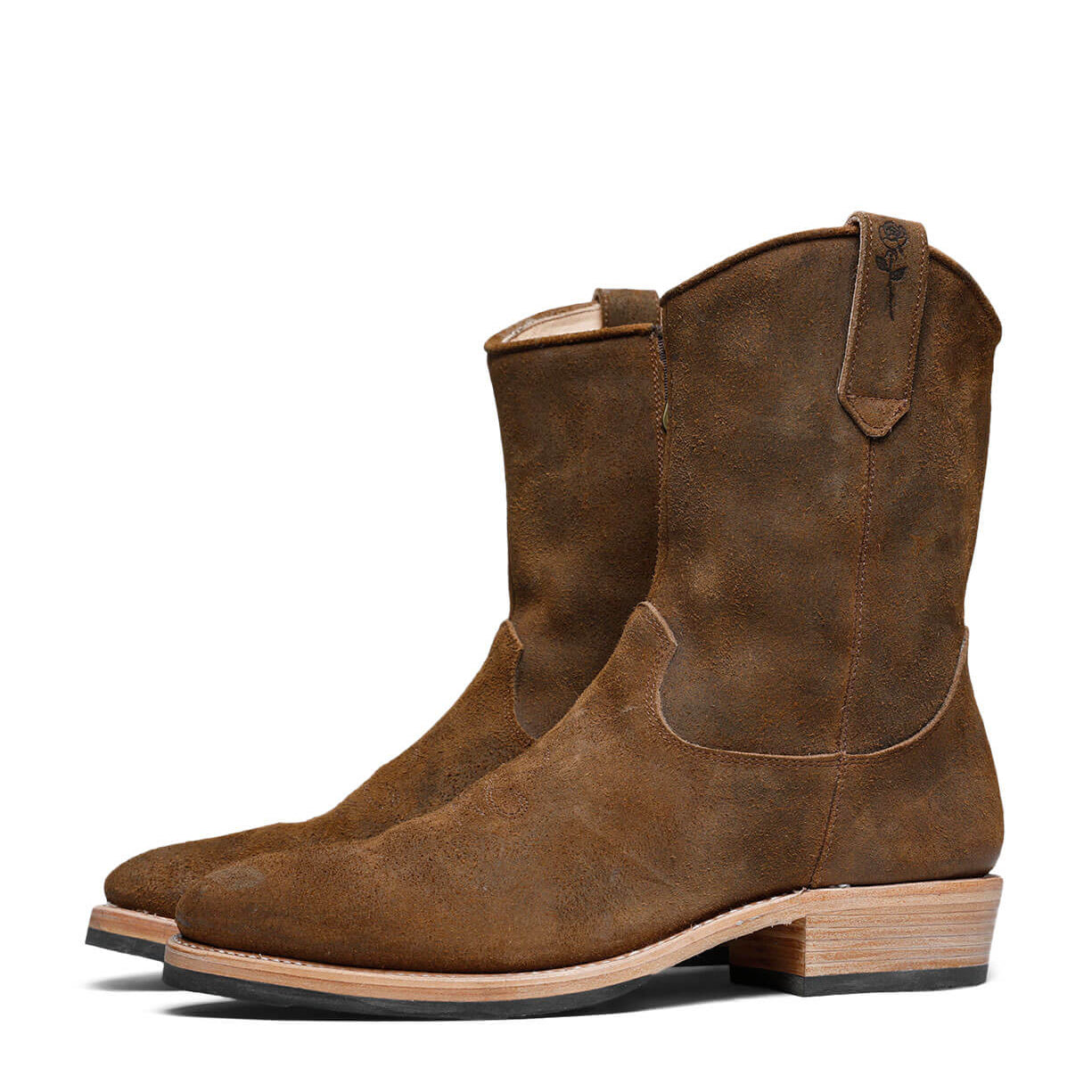 A pair of Isaac Cowboy boots by Santa Rosa Brand on a white background, featuring American Bison Viking suede leather upper and natural vegetable tanned leather lining.